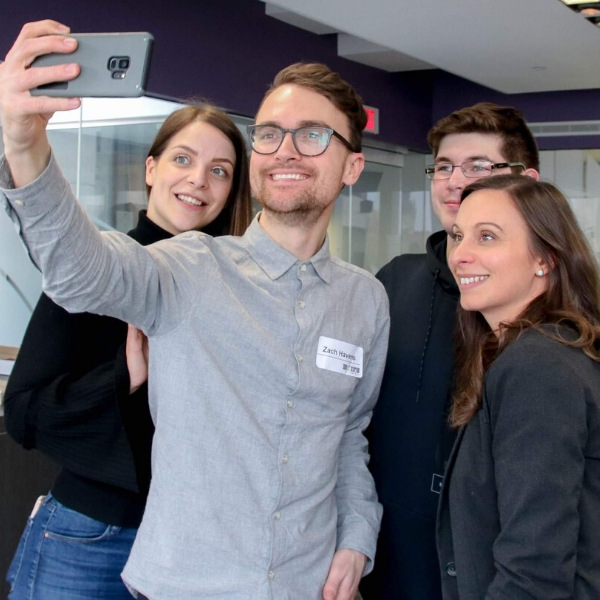 Image of webinar host, Zach Havens, taking a selfie with other entrepreneurs. 