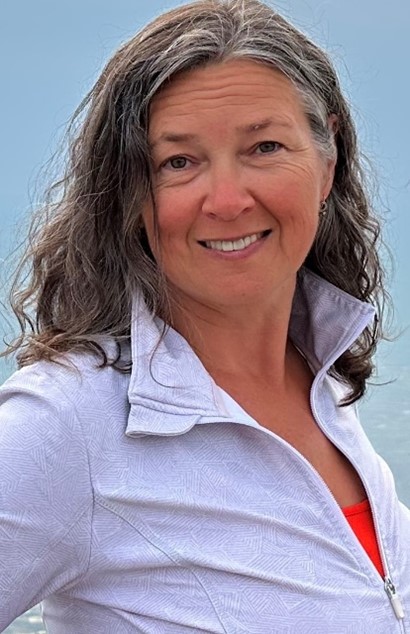 Headshot of Victoria Rubin outside, wearing a light coloured jacket.