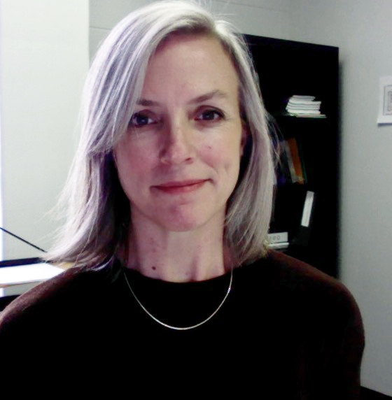 Headshot of Melissa Adler in a dark top.