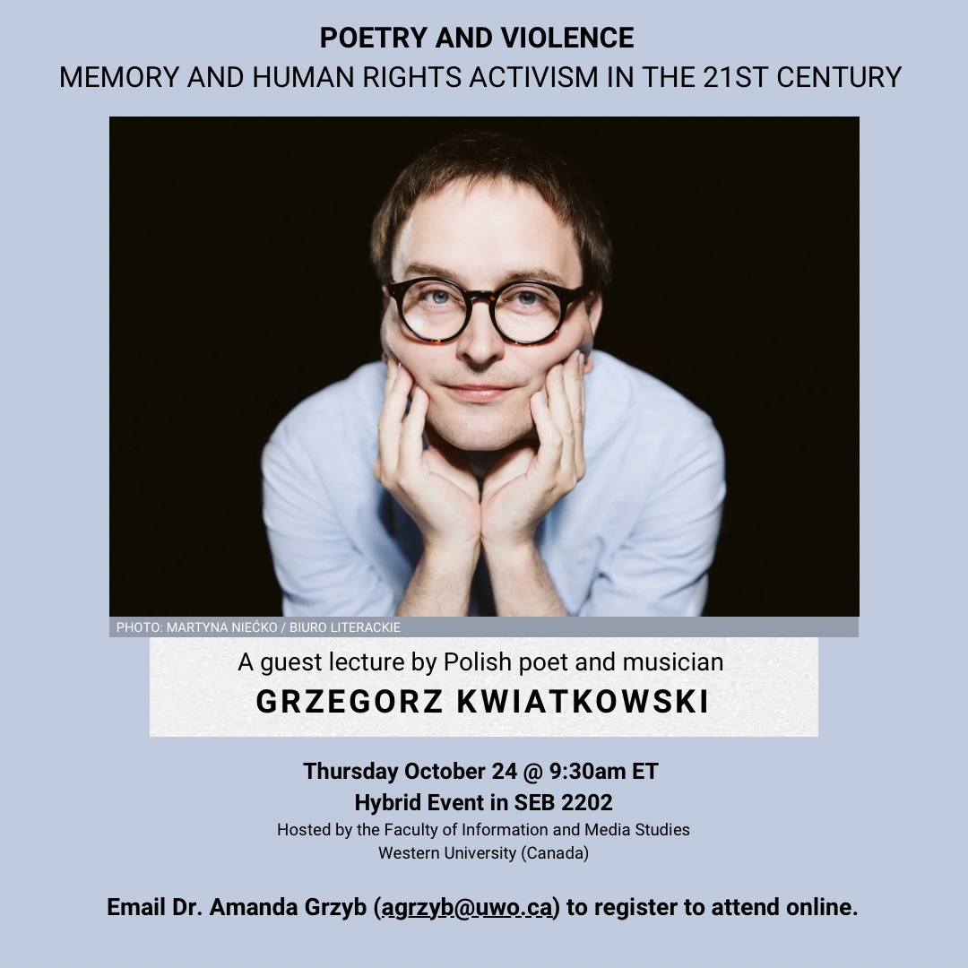 Photo of Grzegorz Kwiatkowski resting his chin in his hands and wearing round glasses.