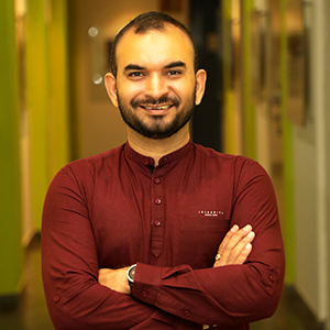 Headshot of Kuldeep Brahmbhatt with his arms crossed.