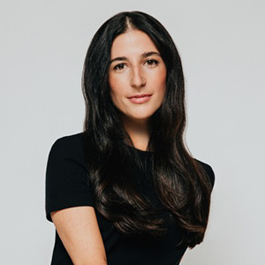 Alessia Grosso in a black shirt against a grey background.
