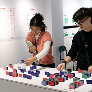 Photo of two students browsing the Glass Room exhibit.