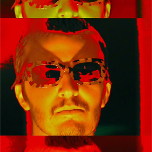 A fashionable image of a man in sunglasses with strong red and orange lighting